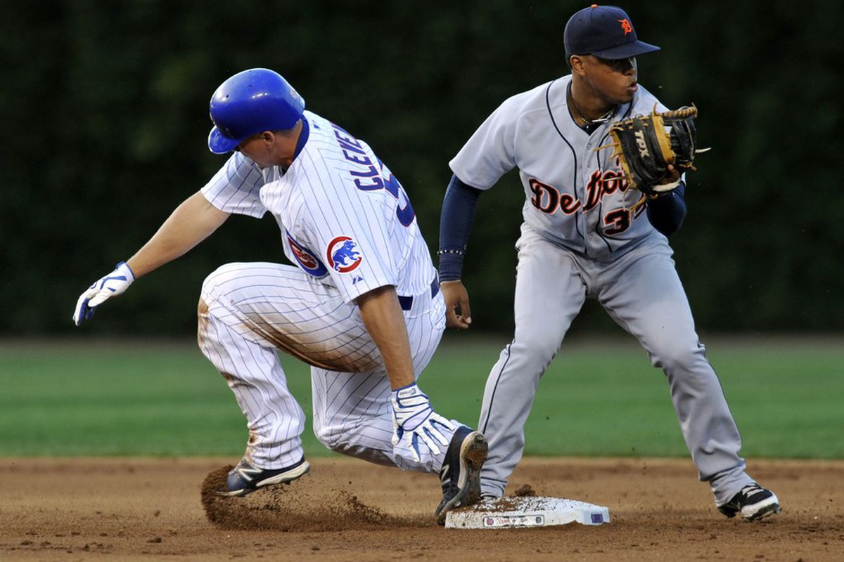 Chicago, IL, USA; Chicago Cubs catcher Steve Clevenger slides safely into second base with a double as Detroit Tigers second baseman Ramon Santiago takes the throw at Wrigley Field. Credit: David Banks-US PRESSWIRE