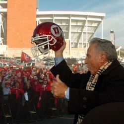 Lee Corso holds up a University of Utah Football helmet and cheers with University of Utah fans before taping some segments for ESPN Game Day at Rice Eccles Stadium on the University of Utah Campus in Salt Lake City.   Photo by Ravell Call, November 19, 2004.