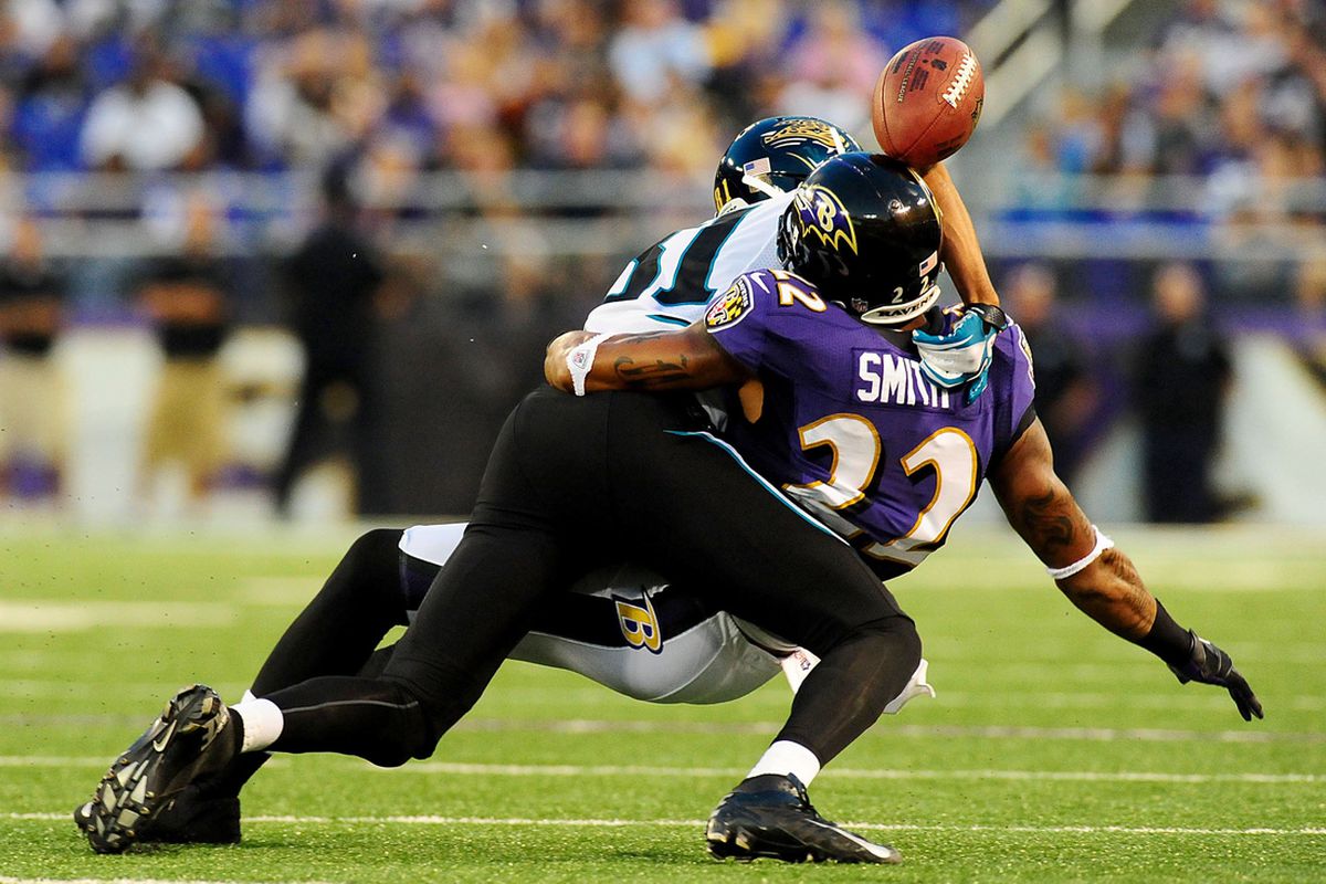 August 23, 2012;Baltimore, MD, USA; Baltimore Ravens cornerback Jimmy Smith (22) fights for a pass with Jacksonville Jaguars wide receiver Laurent Robinson (81) at M&T Bank Stadium. Mandatory Credit: Evan Habeeb-US PRESSWIRE