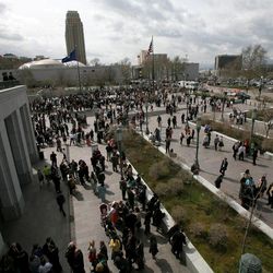People gather between sessions of the 183rd Annual General Conference of The Church of Jesus Christ of Latter-day Saints outside the Conference Center in Salt Lake City on Sunday, April 7, 2013.