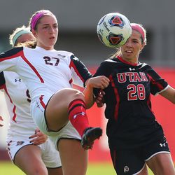 Texas Tech's Mary Heiberger (27) kicks the ball away from Utah's Natalee Wells (28) the University of Utah defeated Texas Tech 1-0 in NCAA Tournament soccer action in Salt Lake City on Saturday, Nov. 12, 2016.