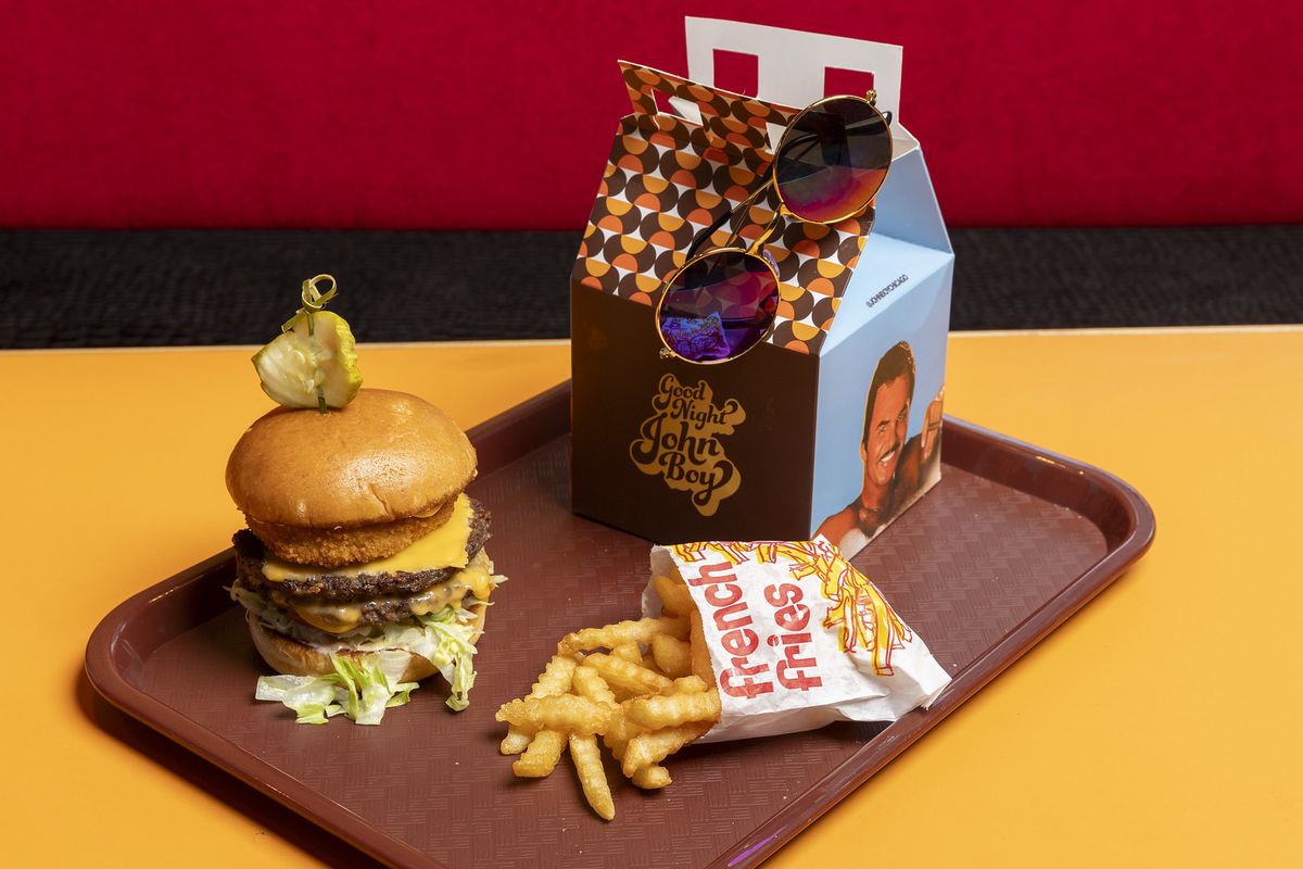 A burger, fries, and a Happy Meal box.