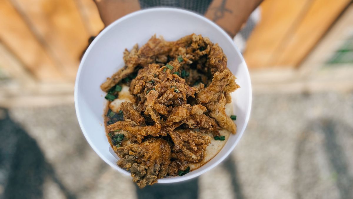 Overhead shot of Mo’ Better Brews’ vegan chik’n fried shrooms over grits.