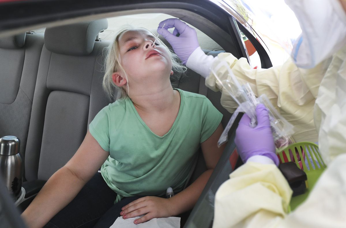 Mikayla Statham, 8, is tested for COVID-19 at Intermountain Healthcare’s Taylorsville Clinic in Taylorsville on Friday, July 17, 2020.