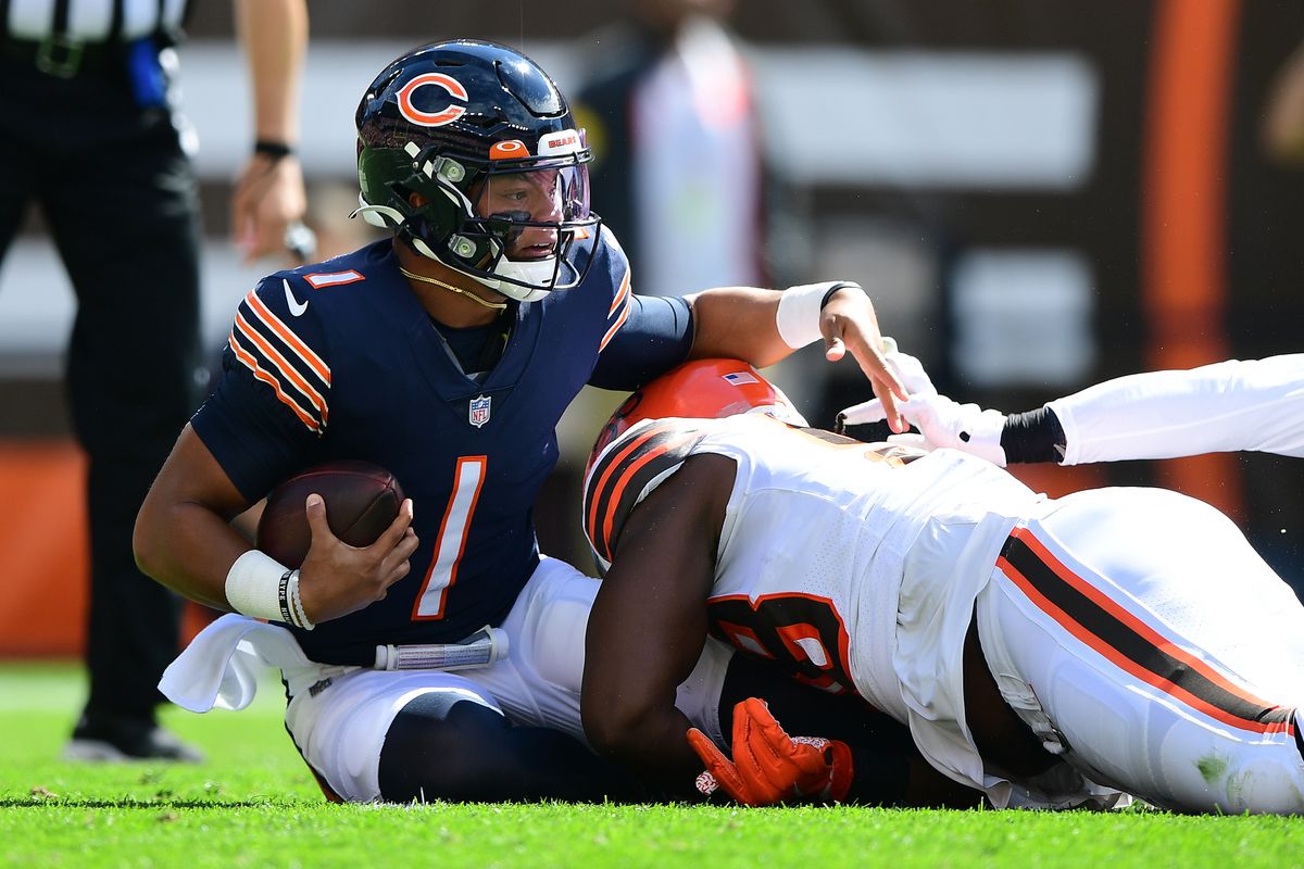 Justin Fields #1 of the Chicago Bears is sacked during the first quarter in the game against the Cleveland Browns at FirstEnergy Stadium on September 26, 2021 in Cleveland, Ohio.