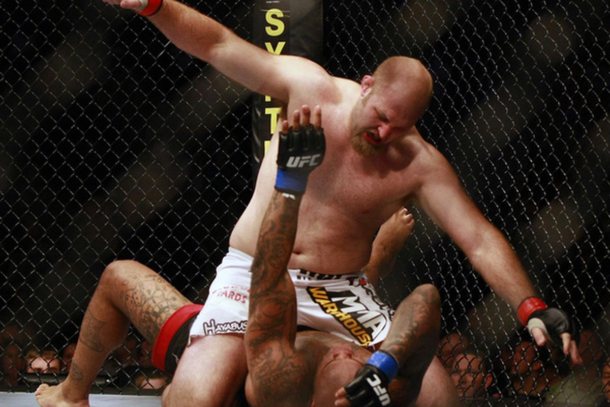 VANCOUVER, CANADA - JUNE 12:   UFC fighters Ben Rothwell (top) and Gilbert Yvel exchange punches during UFC 115 at General Motors Place on June 12, 2010 in Vancouver, British Columbia, Canada. (Photo by Jeff Vinnick/Zuffa, LLC via Getty Images)