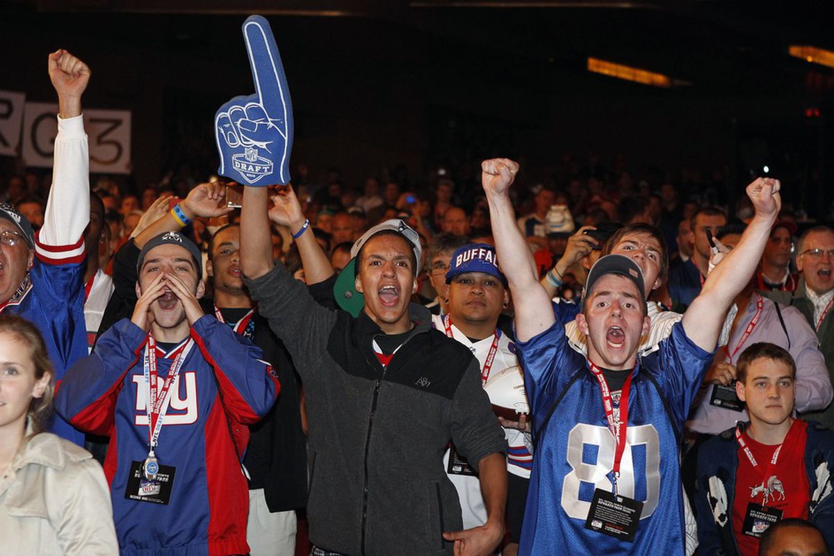 Apr 26, 2012; New York, NY, USA; New York Giant fans react to the pick of David Wilson during the 2012 NFL Draft at Radio City Music Hall Mandatory Credit: William Perlman/The Star-Ledger via US PRESSWIRE
