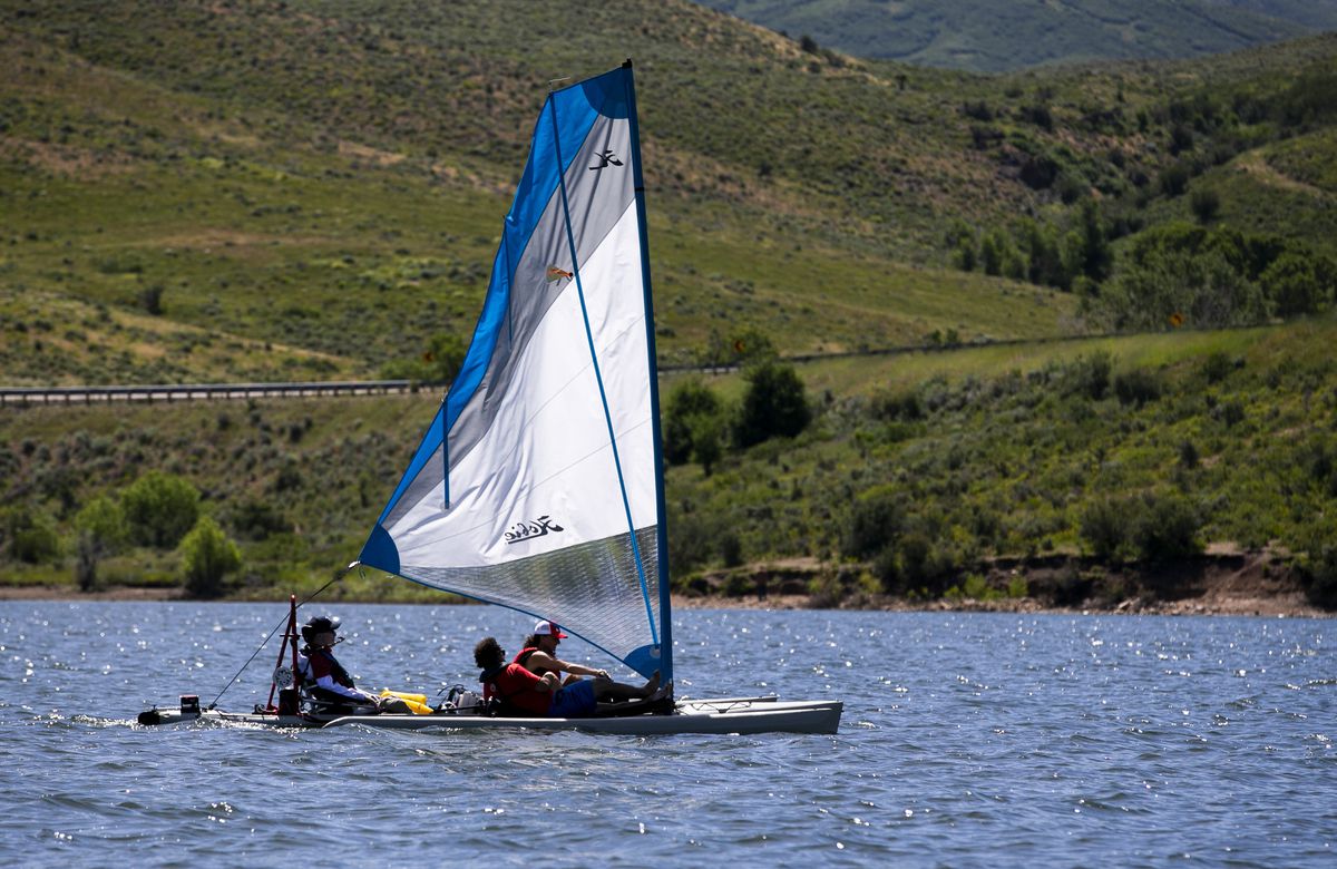 An adaptive sailboat controlled by Derek Sundquist floats on East Canyon Reservoir in East Canyon State Park on Thursday, July 18, 2019. The Tetradapt Initiative offers a variety of adaptive recreation options, including a sailboat that allows quadriplegi