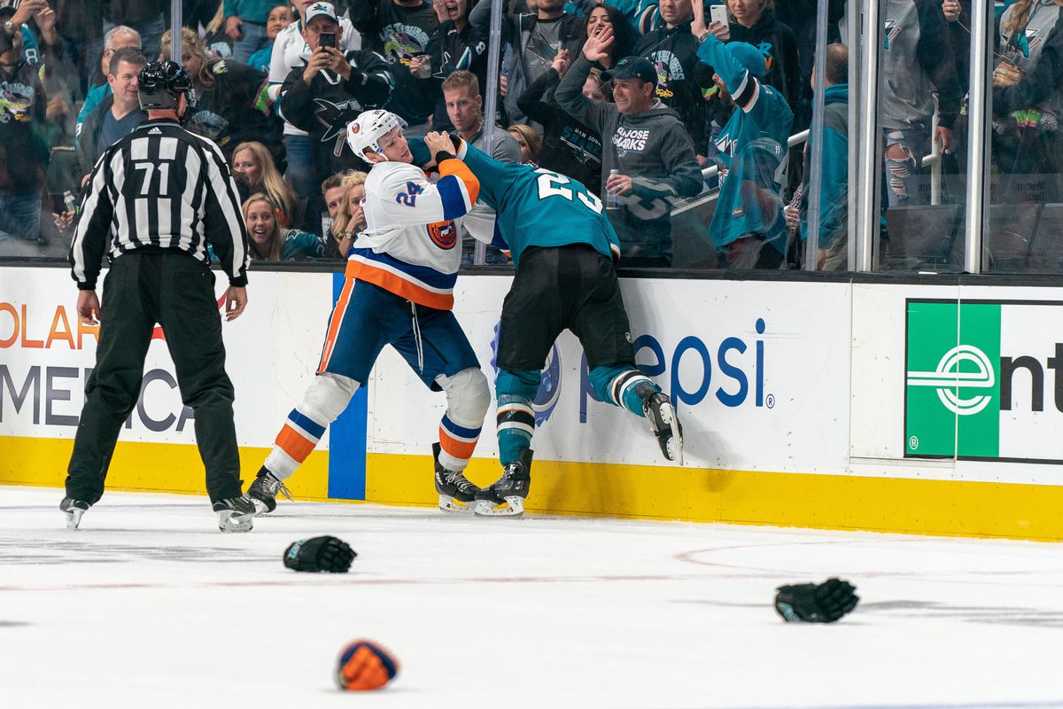 Oct 20, 2018; San Jose, CA, USA; San Jose Sharks right wing Barclay Goodrow (23) and New York Islanders defenseman Scott Mayfield (24) fight during the second period at SAP Center at San Jose.
