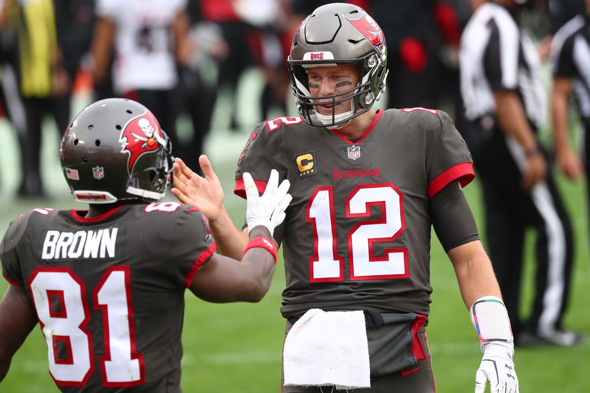 Tampa Bay Buccaneers quarterback Tom Brady (12) smiles with wide receiver Antonio Brown (81) after he scored a touchdown against the Atlanta Falcons during the second half at Raymond James Stadium.
