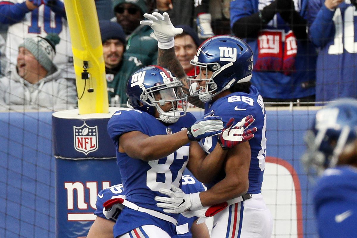 Sterling Shepard and Evan Engram of the New York Giants celebrate a touchdown by Shepard in an NFL football game against the Philadelphia Eagles on December 17, 2017 at MetLife Stadium in East Rutherford, New Jersey.