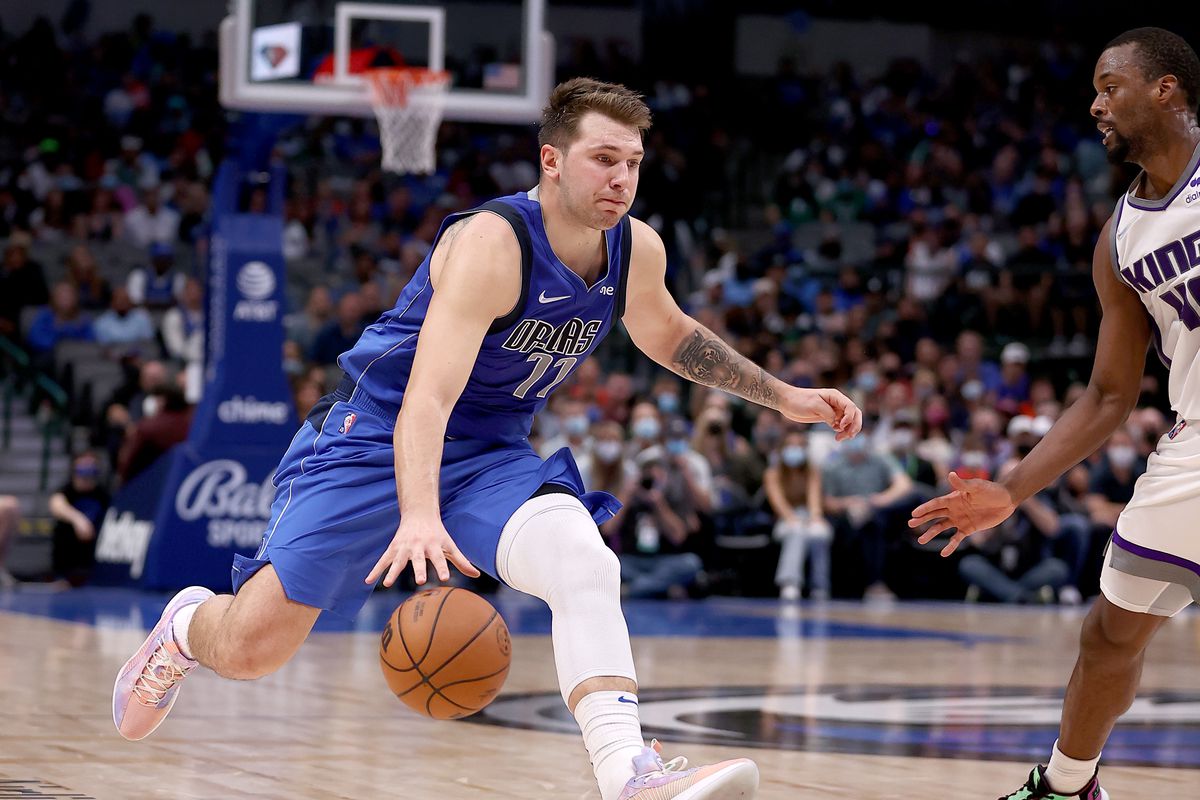 Luka Doncic #77 of the Dallas Mavericks drives to the basket against Harrison Barnes #40 of the Sacramento Kings in the second half at American Airlines Center on October 31, 2021 in Dallas, Texas.&nbsp;