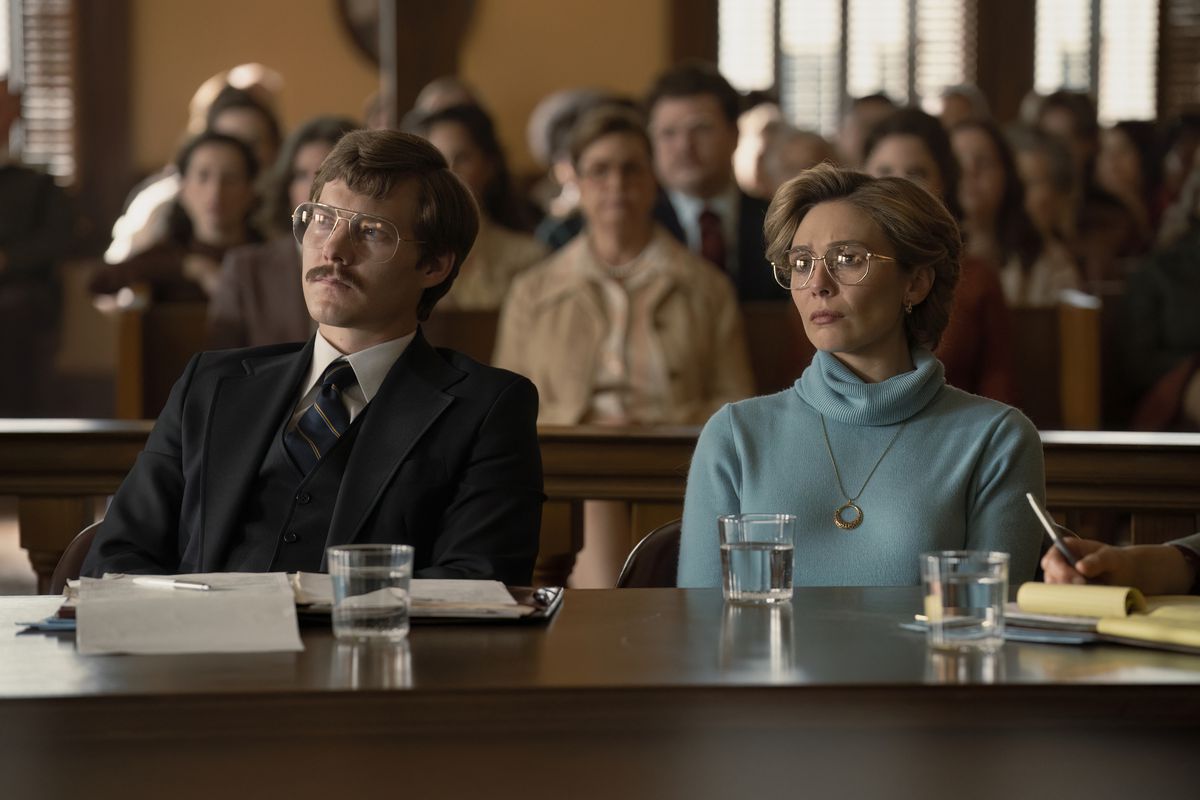 Candy (Elizabeth Olsen) sits next to her lawyer in court in a still from Love &amp; Death