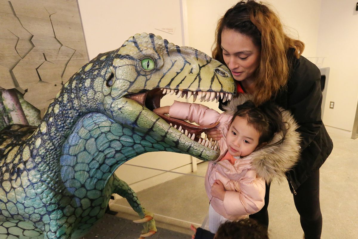 Sandy Phung holds her daughter, Aria, during DinoFest at the Natural History Museum of Utah in Salt Lake City on Sunday, Jan. 29, 2017. This year's event will be held on Saturday, Jan. 26, and Sunday, Jan. 27.