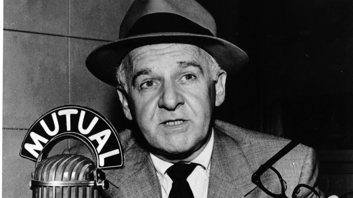 Journalist Walter Winchell broadcasts over the coast-to-coast air waves for Mutual Broadcasting System on Oct. 4, 1955.