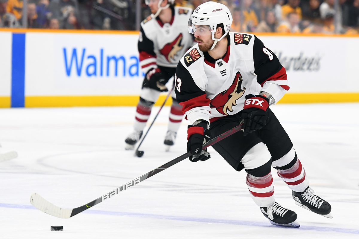 Dec 23, 2019; Nashville, Tennessee, USA; Arizona Coyotes right wing Conor Garland (83) skates the puck into the offensive zone during the second period against the Nashville Predators at Bridgestone Arena.