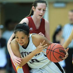 Riverton's Tia Yazzie is fouled by Viewmont's Mercedes Spaples Wednesday, Feb. 18, 2015, in 5A State quarterfinal action at Salt Lake Community College in Taylorsville.