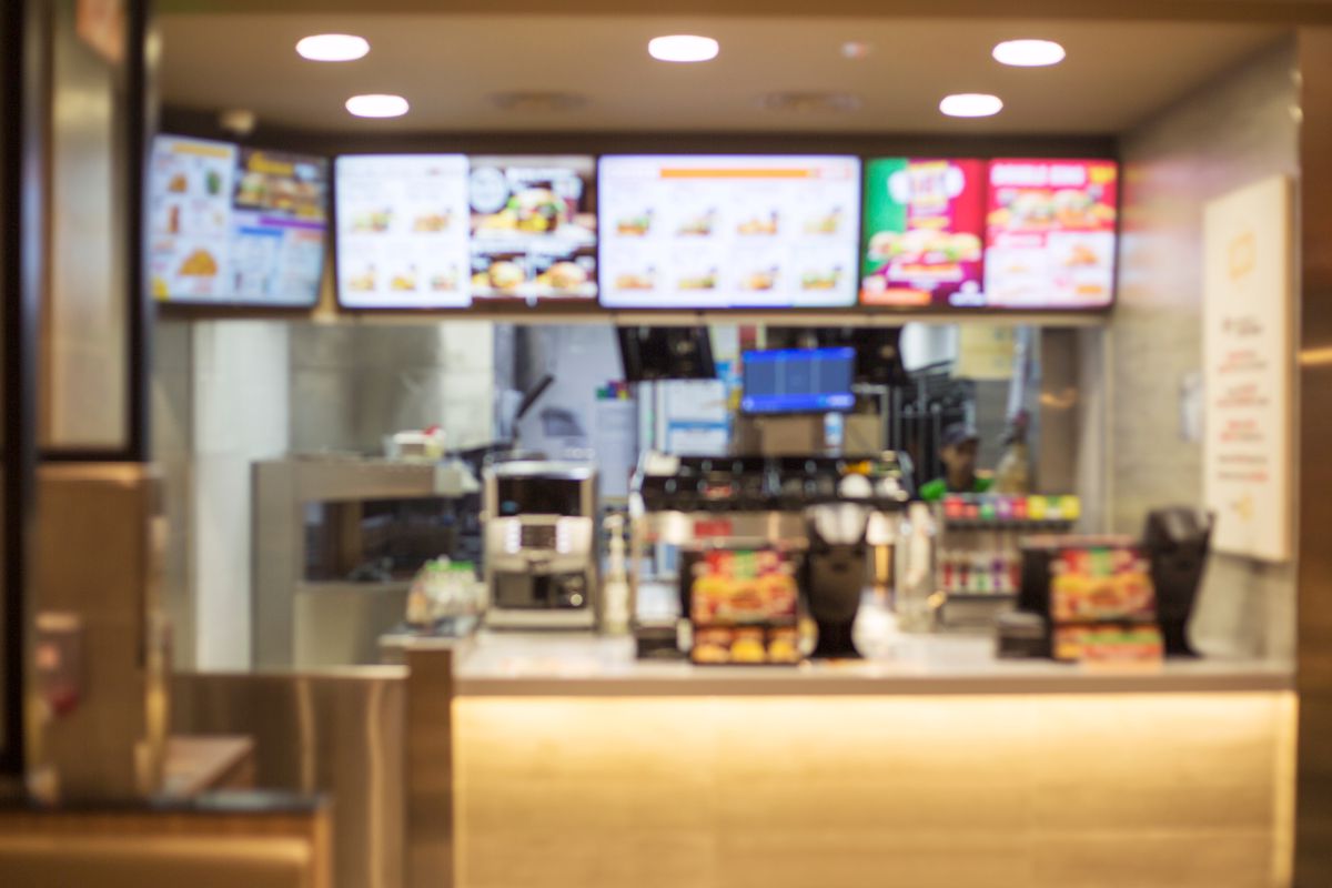 A blurry view of a fast food restaurant.