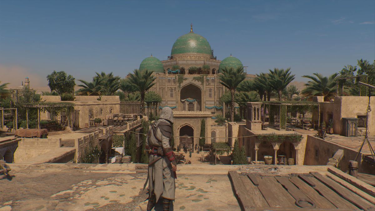 Basim looks out at a courtyard in front of a mosque in Assassin’s Creed Mirage