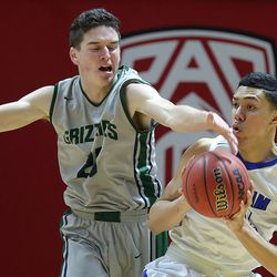 Copper Hills's Charlie Olsen (21) tries to knock the ball away from Bingham's Samuta Avea (32) as Bingham and Copper Hills play for the 5A basketball championship in the Huntsman Center at the University of Utah Saturday, March 5, 2016. Bingham won 61-44.