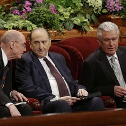 President Thomas S. Monson, center, and his two counselors, Henry B. Eyring, left, and Dieter F. Uchtdorf, right, talk during the 183rd Annual General Conference of The Church of Jesus Christ of Latter-day Saints Saturday, April 6, 2013, in Salt Lake City. Saturday, April 6, 2013, in Salt Lake City. The Mormon church is planning to build two new temples in Rio de Janeiro and Cedar City, Utah. The faith's president, Thomas S. Monson, announced the new temples on Saturday during the 183rd semi-annual general conference of The Church of Jesus Christ of Latter-day Saints. More than 100,000 members of the church have gathered in Salt Lake City to hear words of inspiration and guidance for daily living from the faith's senior leaders.  (AP Photo/Rick Bowmer) 