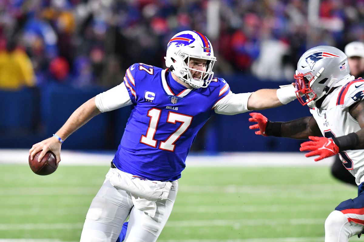 Buffalo Bills quarterback Josh Allen (17) tries to break free from New England Patriots outside linebacker Matt Judon (9) in the third quarter at Highmark Stadium.