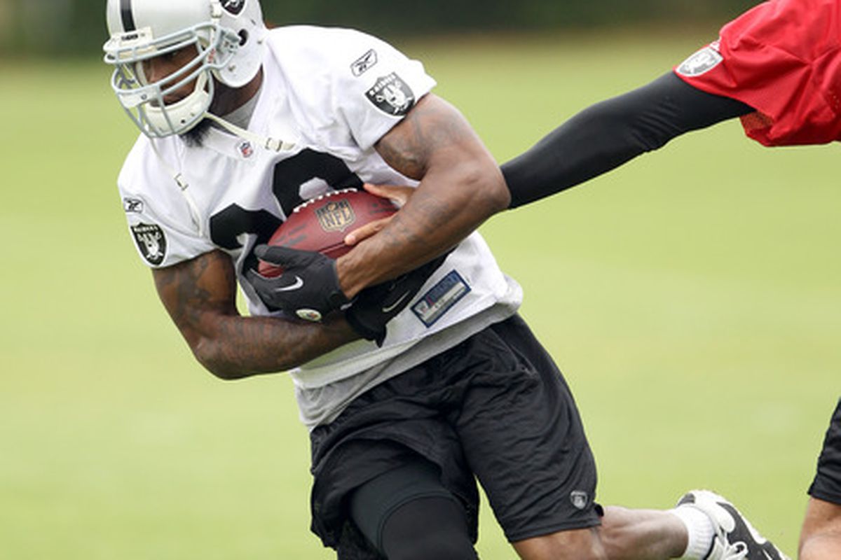 Darren McFadden #20 of the Oakland Raiders works out during the Raiders training camp