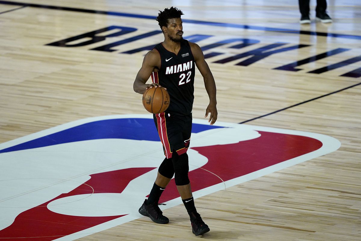 Jimmy Butler of the Miami Heat brings the ball up against the Toronto Raptors in the second half at HP Field House at ESPN Wide World Of Sports Complex on August 3, 2020 in Lake Buena Vista, Florida.