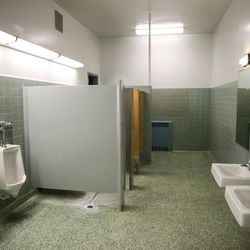 A boys bathroom is seen at Midvalley Elementary in Midvale on Tuesday, Aug. 22, 2017. None of the bathrooms have functional drains, making custodial services a challenge.