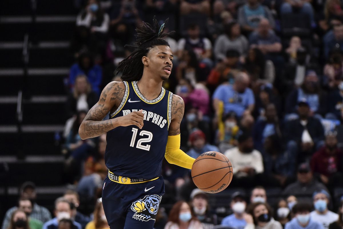 Memphis Grizzlies guard Ja Morant (12) brings the ball up court during the second half against the San Antonio Spurs at FedExForum.