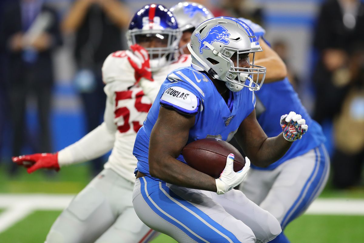 Tra Carson of the Detroit Lions looks for running room during a first half run against the New York Giants at Ford Field on October 27, 2019 in Detroit, Michigan.