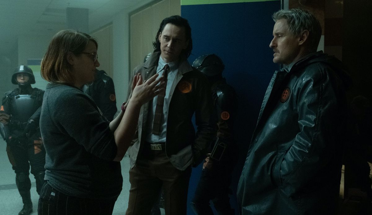 Kate Herron discusses a scene with Tom Hiddleston and Owen Wilson on the set of Loki