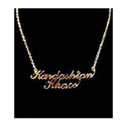 Gold nameplate <a href="http://kardashiankhaos.com/jewelry/kardaishian-khaos-gold-nameplate-necklace.html">necklace</a>, $100.