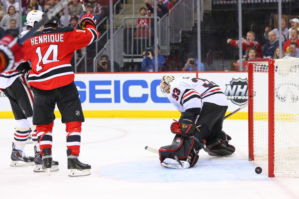 Adam Henrique celebrated Mike Cammalleri's goal in this photo. Will he do it again tonight? It won't be easy what with it being in Chicago.