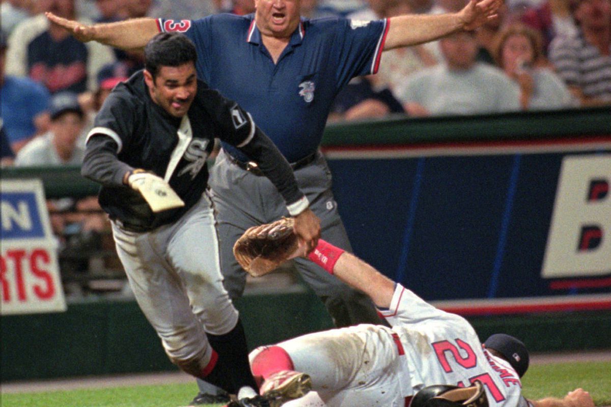 Ozzie Guillen is safe at third and heads for home after Cleveland Indians third baseman Jim Thome couldn't come up with a throw in the ninth inning on July 5, 1996. (Piet van Lier -- AP)