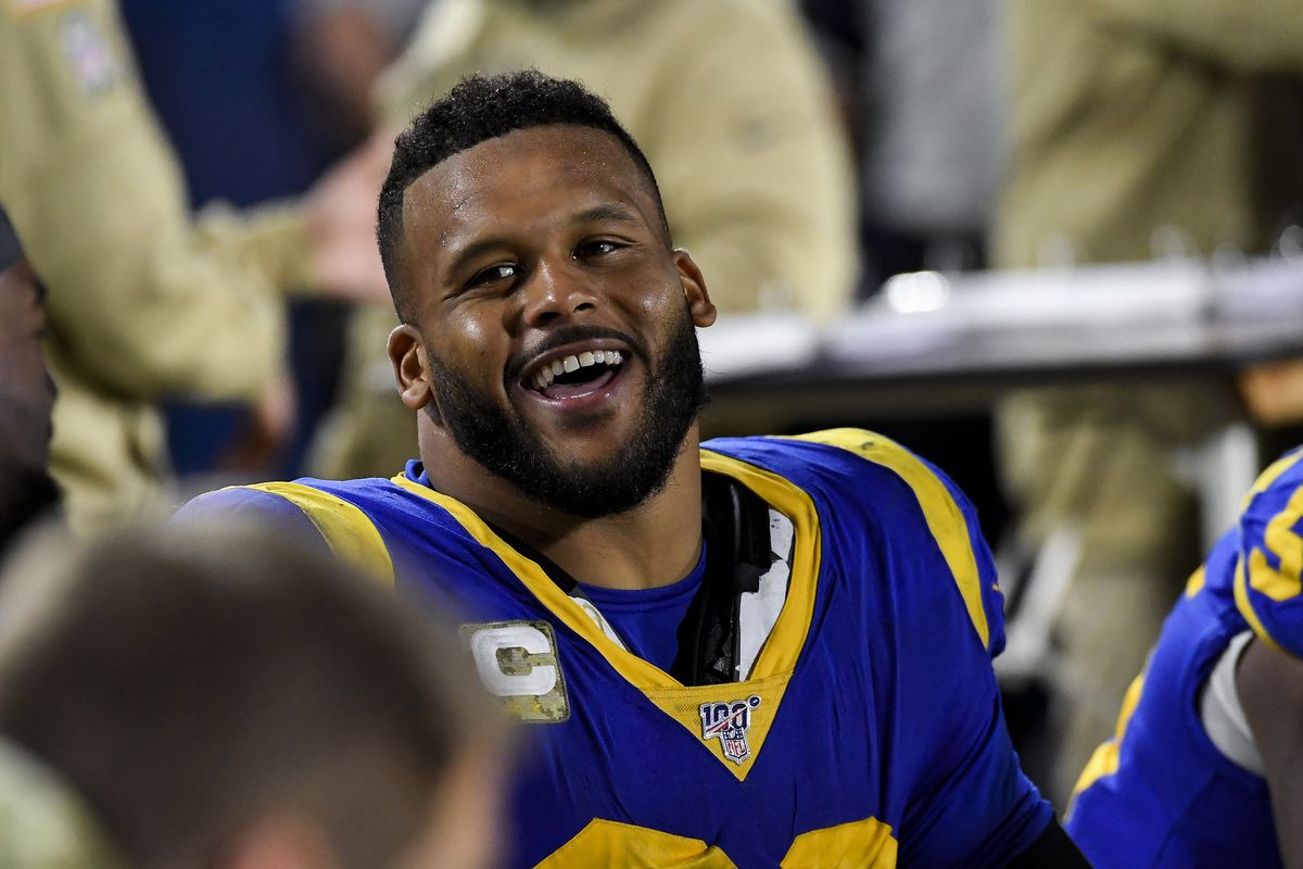 Aaron Donald #99 of The Los Angeles Rams speaks to teammates on the bench prior the beginning of the second half of a game against the Chicago Bears at Los Angeles Memorial Coliseum on November 17, 2019 in Los Angeles, California. Los Angeles Rams defeated the Chicago Bears 17 - 7.