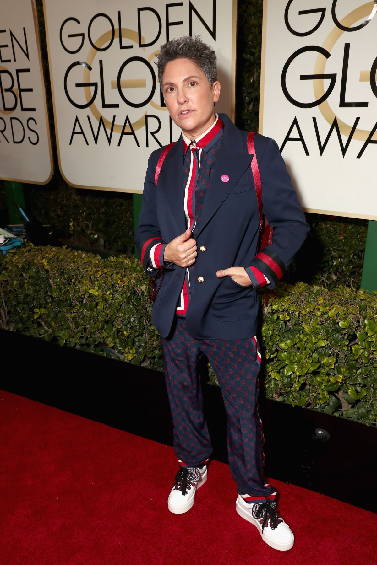 Jill Soloway with red backpack on Golden Globes red carpet