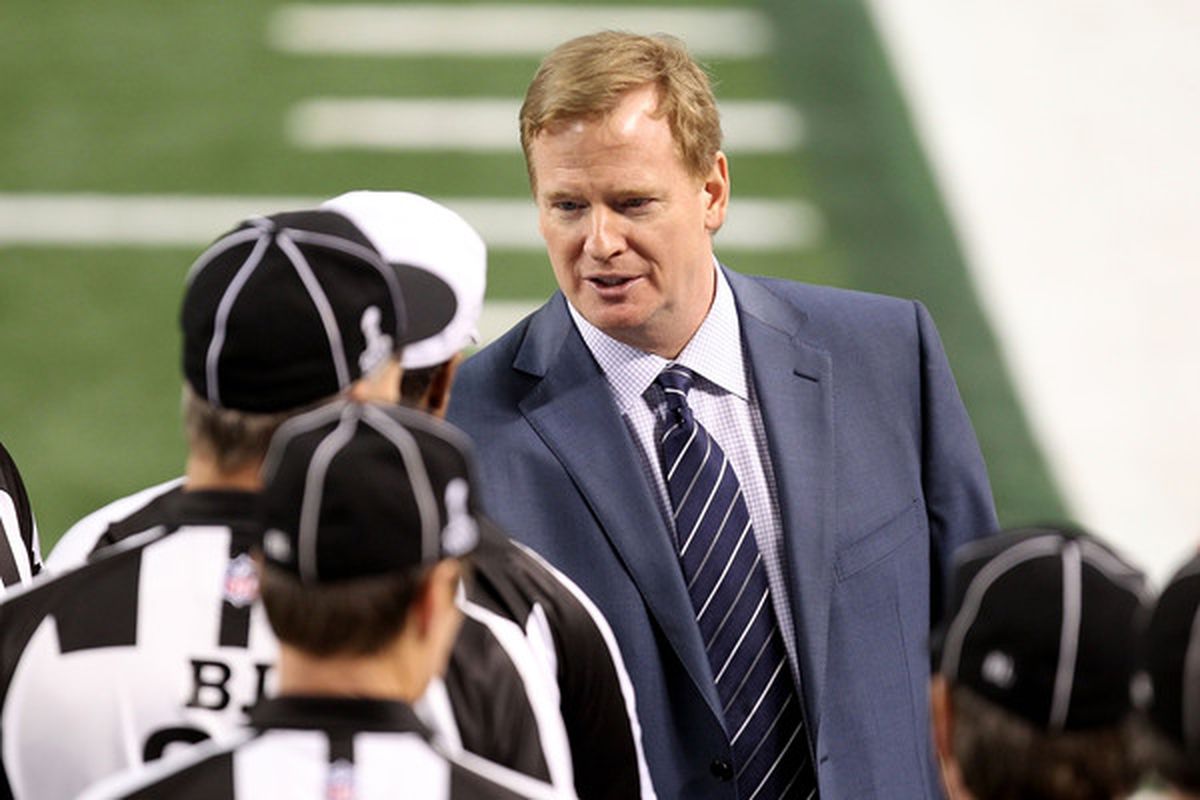 ARLINGTON TX - FEBRUARY 06: NFL Commissioner Roger Goodell (R) speaks with Head Referee Walk Anderson during Super Bowl XLV at Cowboys Stadium on February 6 2011 in Arlington Texas.  (Photo by Mike Ehrmann/Getty Images)