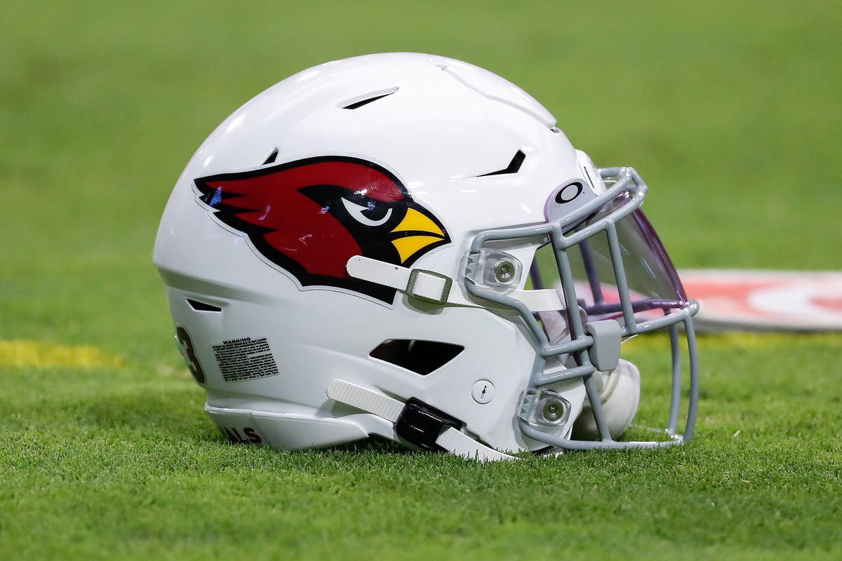 An Arizona Cardinals helmet on the grass during Arizona Cardinals training camp on July 30, 2021 at State Farm Stadium in Glendale, Arizona.