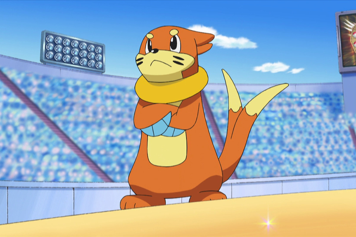 A Buizel stands in a stadium with its arms crossed