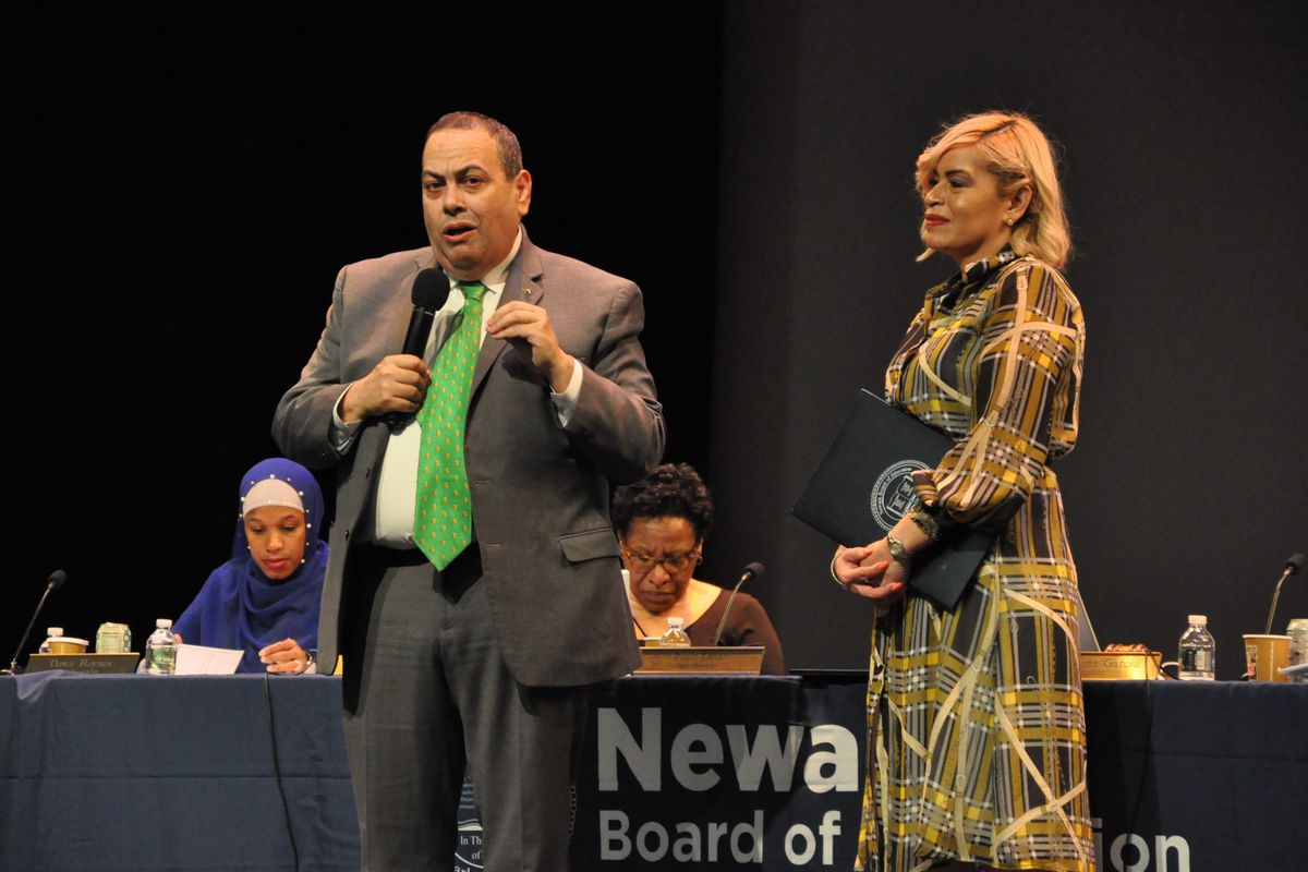 Newark superintendent Roger León, alongside board president Josephine Garcia, addresses the crowd at the November 26, 2019, school board meeting.