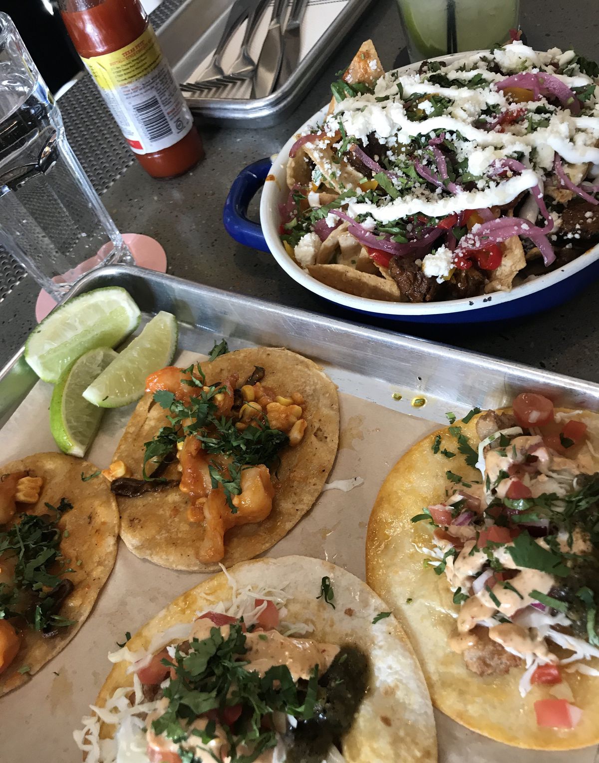 Truck Stop Nachos with brisket barbacoa and assorted tacos at Lonesome Rose restaurant. | Ji Suk Yi / Sun-Times