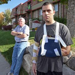 Paul Heaton is recovering from injuries he sustained last Tuesday when he was hit by a car while riding his bicycle. His father, Kirk Heaton, stands in the background  Monday, Oct. 24, 2011, in Salt Lake City, Utah.