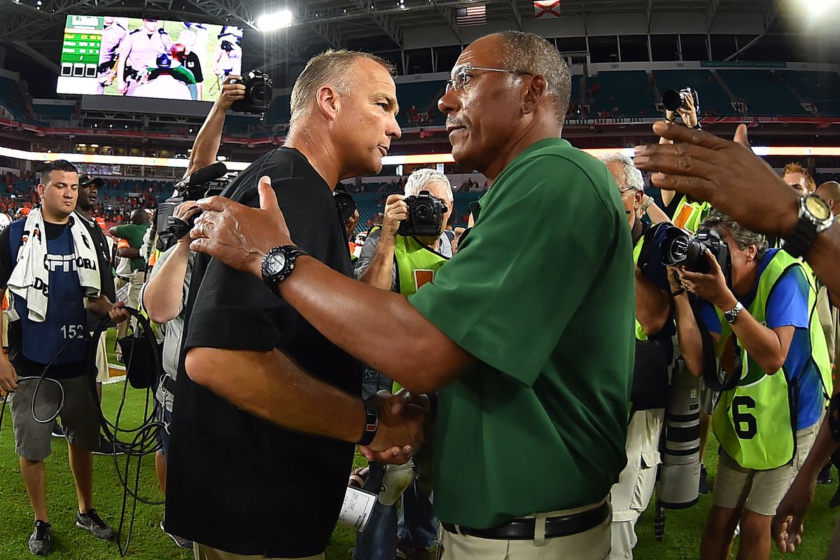 Mark Richt embraces the FAMU coach after the game on Saturday
