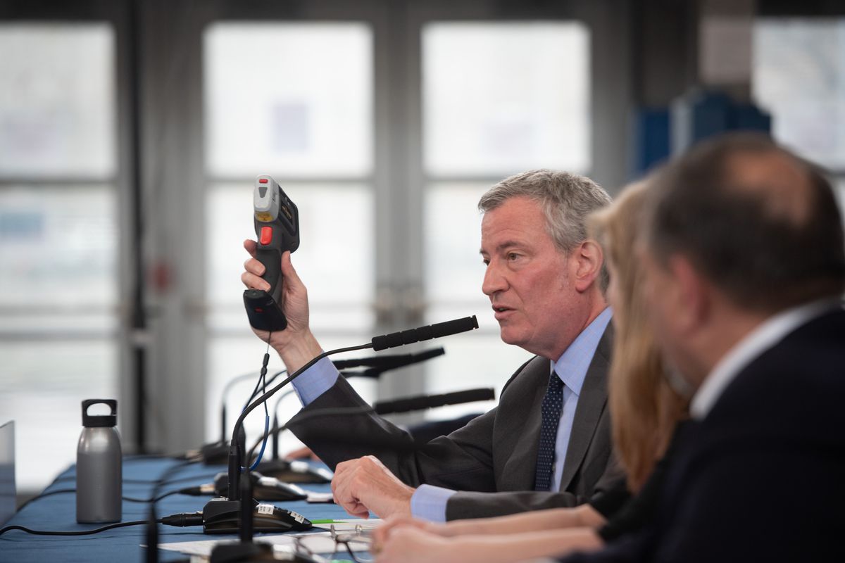 Mayor Bill de Blasio shows a lead paint tester during a press conference at the Williamsburg Community Center in Brooklyn, April 15, 2019.