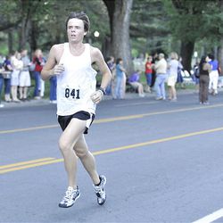 Braden Perry runs the Deseret News 10K race that started in Research Park and ended in Liberty Park in Salt Lake City Saturday.
