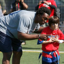 BYU's Ziggy Ansah participates in the NFL "Play 60" event for kids prior to the 2013 NFL draft.