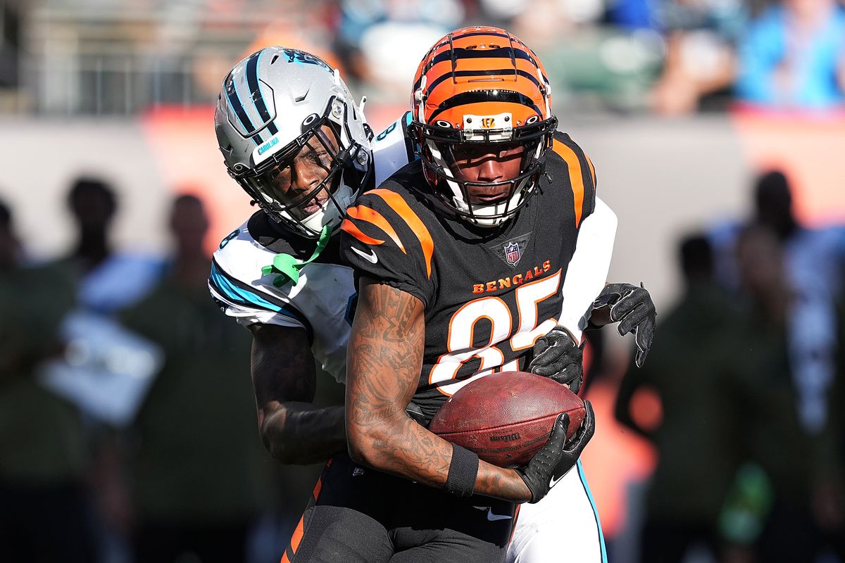 Tee Higgins of the Cincinnati Bengals is tackled by Jaycee Horn of the Carolina Panthers during the third quarter at Paycor Stadium on November 06, 2022 in Cincinnati, Ohio.