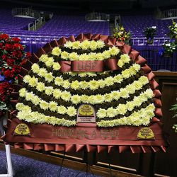 Flower arrangements are in place before funeral services for Utah Highway Patrol trooper Eric Ellsworth at the Dee Events Center in Ogden on Wednesday, Nov. 30, 2016.