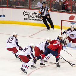 WASHINGTON, DC - November 11, 2014:  Washington Capitals defenseman Matt Niskanen (2) loses the puck as he is heavily defended by four Columbus Blue Jackets during their NHL ice hockey game at Verizon Center. (Photo by Clyde Caplan/clydeorama.com)